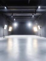 This spacious and empty photo studio boasts modern lighting setups, making it an ideal choice for a wide range of photography and videography projects, ensuring excellent visual outcomes