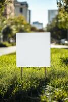Blank sign on grass in city park photo
