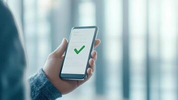 businessman approving document on smartphone with checkmark. scene conveys sense of professionalism and efficiency in modern office environment photo
