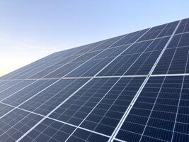 Solar cell panels with a sky background. Solar battery farm. An alternative source of electricity photo