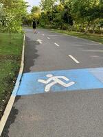 running man symbolic on route park background photo