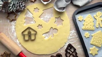 Baker adding christmas cookie cutters to dough video