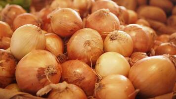 Fresh, vibrant, and aromatic onions are perfectly piled in a rustic market basket, ready for use video