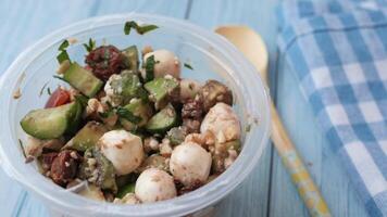 A Fresh Salad with Delicious Mozzarella and Colorful Vegetables in a Clear Container video