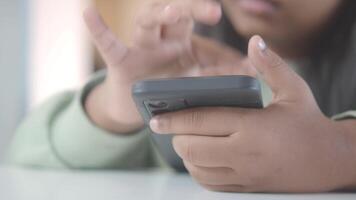 A Childs Hand Skillfully Using a Smartphone with a Focused and Engaging Gesture video