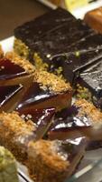An array of delicious assorted desserts beautifully presented on display video
