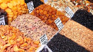 A Vibrant Display of Colorful Dried Fruits and Nuts at a Local Market Stall video
