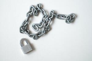 iron chain and padlock on white background photo