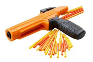 Toy blaster with colorful projectiles laid out for playtime fun in an outdoor setting png