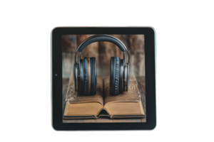 Headphones resting on an open book displayed on a tablet, merging technology with literature for an engaging reading experience png