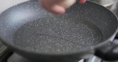 Cracking Egg into Nonstick Frying Pan video