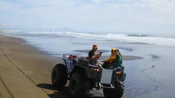 Active Rest In Nature And Tourism, Group Of Travelers Riding By Mud Quad On Beautiful Oceanic Shore video