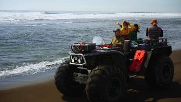 Active Rest In Nature, Group Of Tourists Riding Quad With Monster Tires On Seacoast, Slow Motion video