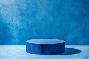 Blue rounded podium on a bright blue background. Minimalistic photo style