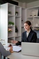 Asian lawyer concluding contract discussion with client photo