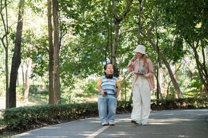 Joyful Stroll in the Park Embracing Diversity and Friendship with a Person with Achondroplasia photo