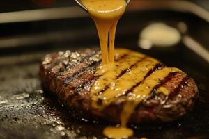 Drizzling Sauce Over a Grilled Steak photo