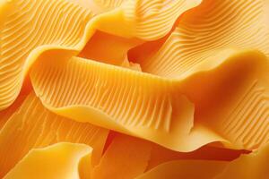 Close-up of Yellow Cheese with Wavy Lines and Textures photo