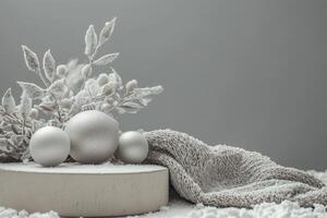 Silver Christmas Ornaments with Snowy Foliage and Knit Fabric on a White Background photo