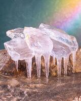 Sparkling ice crystals on a rocky surface photo
