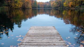serene autumn lake with wooden dock photo