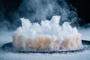 Frozen crystals of ice on a dark surface photo