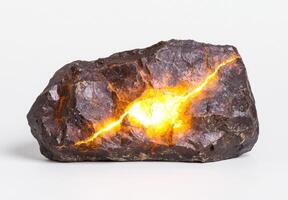 Glowing rock with fiery cracks photo
