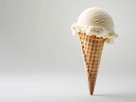 Delicious vanilla ice cream scoop in waffle cone photo