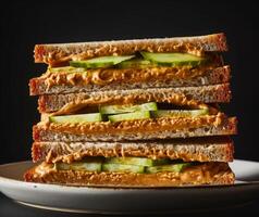 Tasty peanut butter and cucumber sandwich on whole grain bread photo