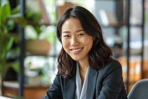 smiling asian woman in business attire photo