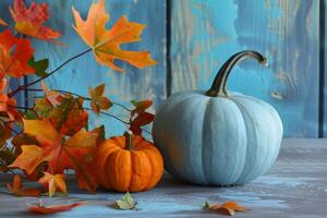 Autumn pumpkins and leaves on rustic wooden background photo