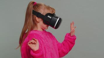 Preteen child girl kid using headset app to play simulation game watching virtual reality 3D video