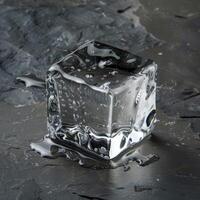 Crystal Clear Ice Cube on a Dark Textured Surface photo