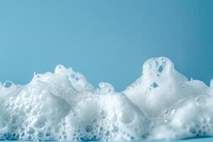 Close up of white foam against a blue background photo
