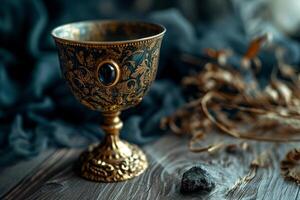 Elegant vintage goblet on a wooden surface with decorative background photo