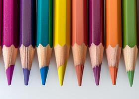 Colorful array of sharpened pencils lined up photo