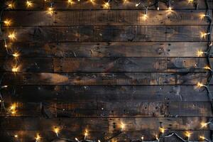 Festive string lights on a rustic wooden background photo