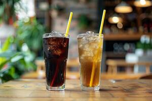 Two refreshing glasses of soda with ice on a cafe table photo