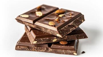 Stack of chocolate bars with almonds on a white background photo