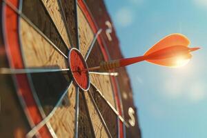 Dart hitting the bullseye on a dartboard under sunlight photo