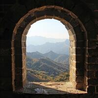 View through an ancient archway overlooking mountainous landscape photo