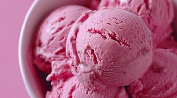 Close up of Scoops of Strawberry Ice Cream in a Bowl photo