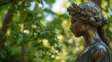 Bronze statue of a woman in a serene park setting photo