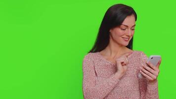 Girl using smartphone pointing empty place, positive feedback recommends social networks application video