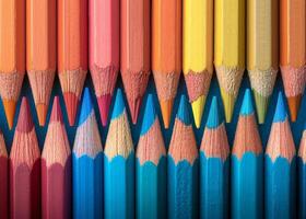 Colorful array of sharpened pencils lined up photo