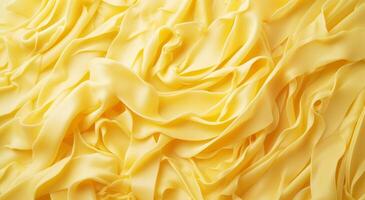 Smooth yellow fabric texture with elegant drapery photo