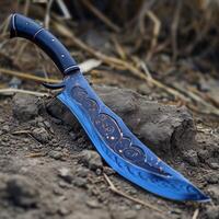 Decorative knife with intricate designs stuck in the ground photo