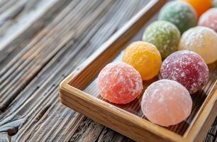 Assorted colorful mochi ice cream on a wooden tray photo