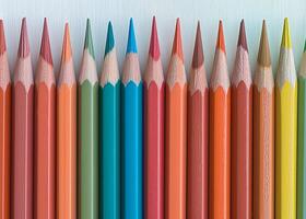 Row of Sharpened Colored Pencils Against a White Background photo