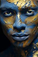 Portrait of a person with artistic blue and gold face paint photo